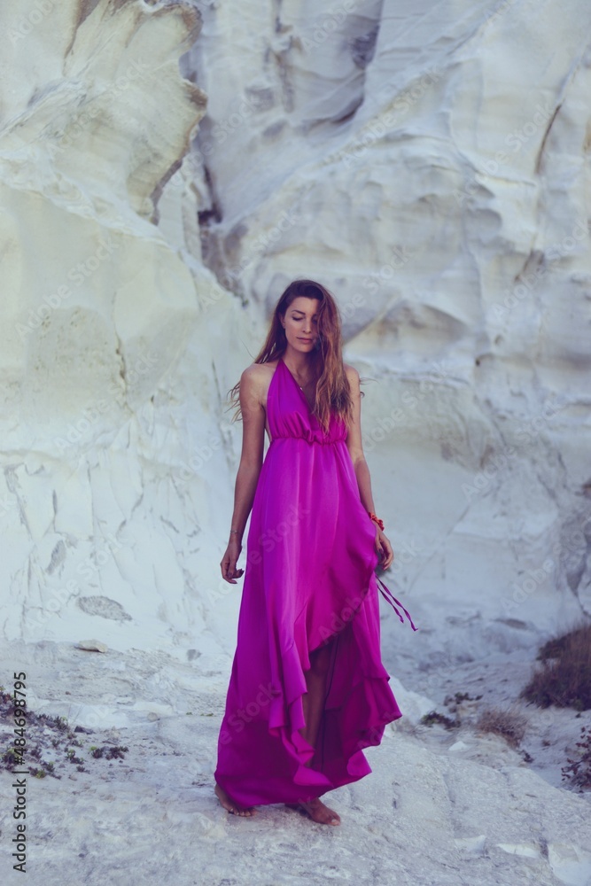 women in a pink dress in milos greece model shooting 