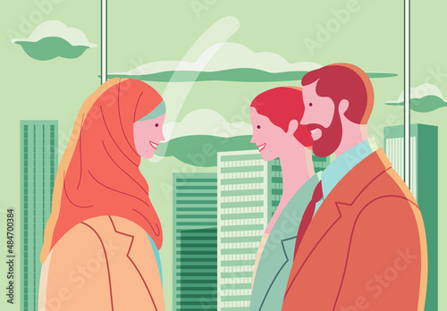 Young Muslim business woman in hijab happy in multicultural team. Three cheerful business people. Large window overlooking skyscrapers.
