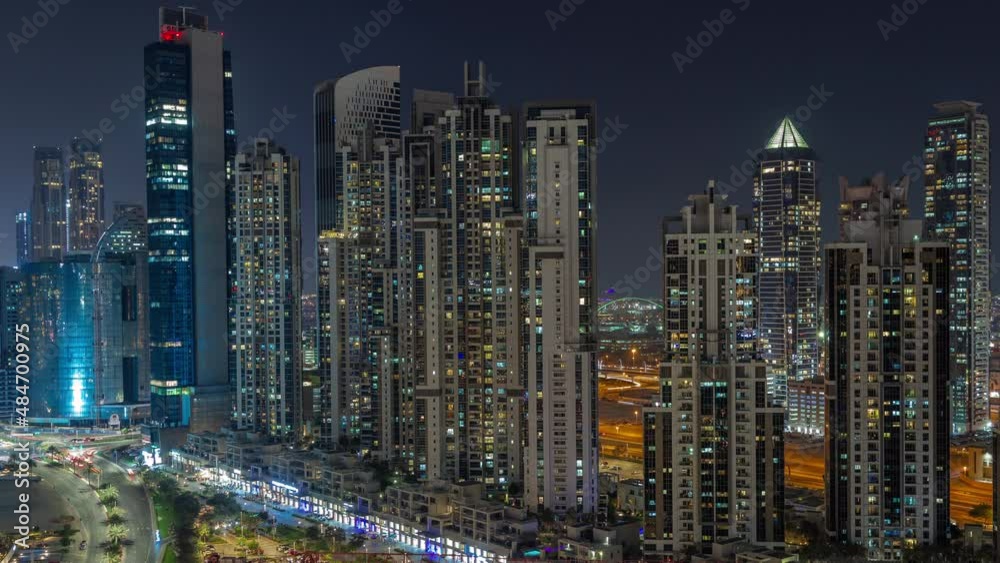 Bay Avenue with modern towers residential development in Business Bay aerial night timelapse, Dubai Bay Avenue with modern towers residential development in Business Bay aerial night timelapse, Dubai