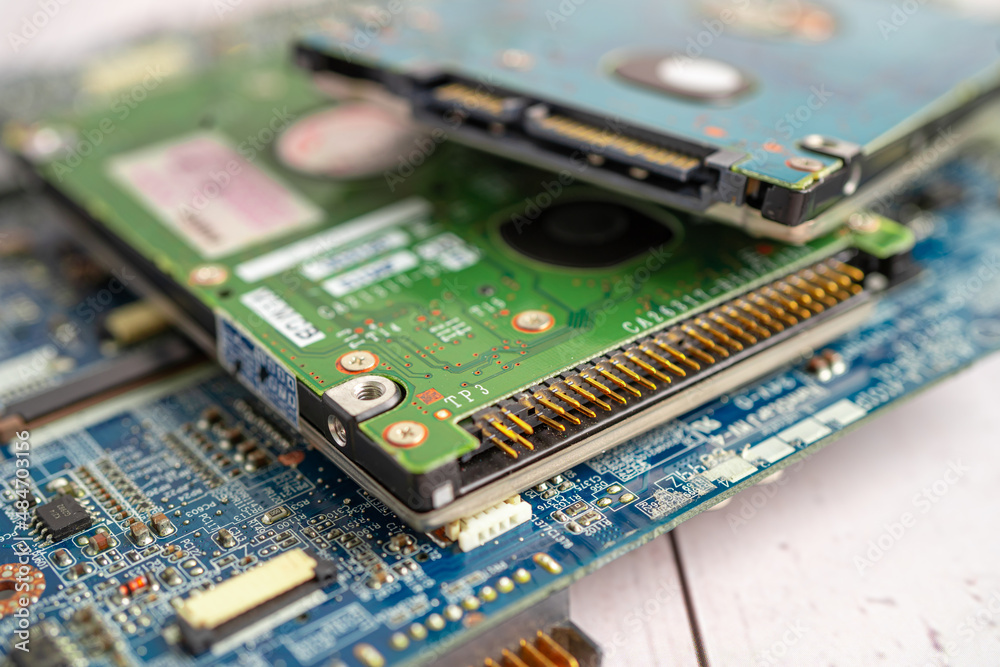 Technician repairing inside of mobile phone by soldering iron. Integrated Circuit. the concept of data, hardware, technology. Technician repairing inside of mobile phone by soldering iron. Integrated Circuit. the concept of data, hardware, technology.
