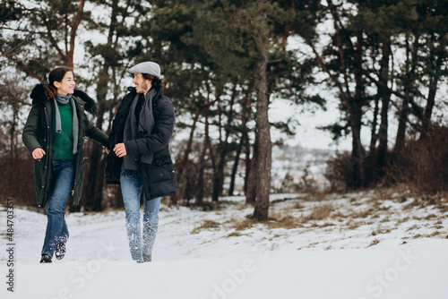 Couple together in winter park having fun © Petro