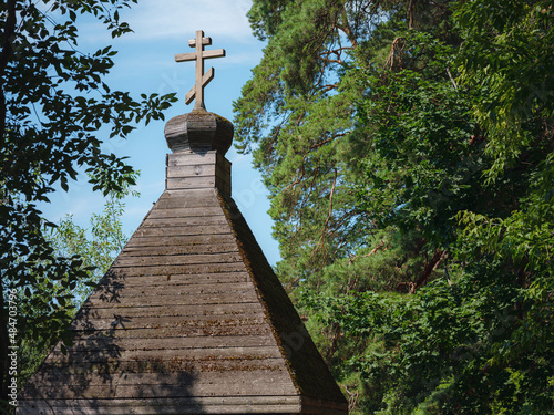 Journey through summer Russia, significant tourist places. wooden roof with cross in chapel-font of Church of Michael Archangel in Arkhangelsk, Moscow region, Russia