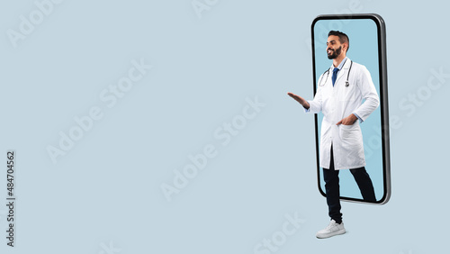 Doctor coming out big smartphone screen, panorama photo