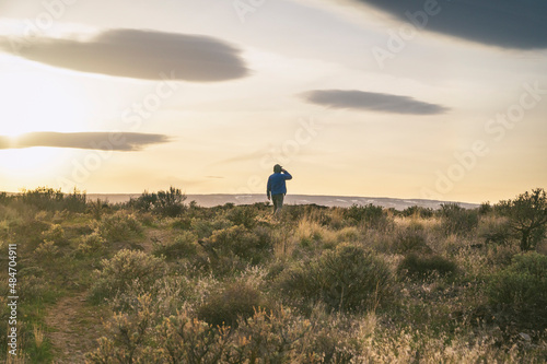Wallpaper Mural Male hiking through the sagebrush desert at sunset Torontodigital.ca