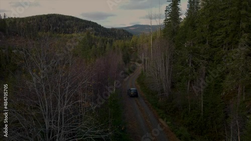 Land Rover Driving off into the Norwegian mountains 4K Drone photo