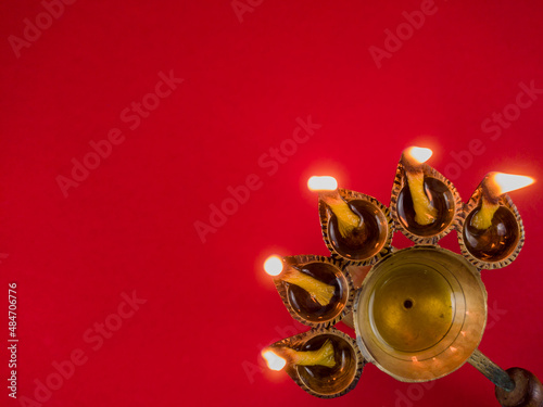 hindu puja essential panch pradeep or five headed oil lamp burning with glowing flame. these are used in durga , saraswati , kali , laxmi puja, shivaratri. photo