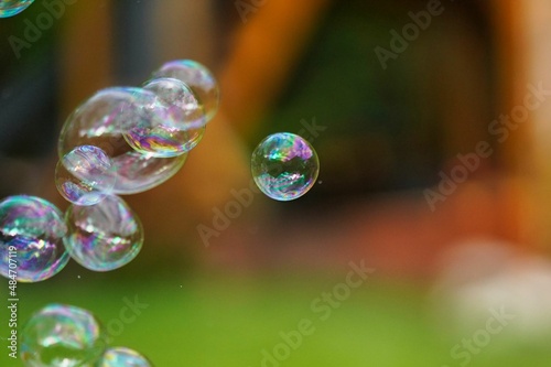 soap bubbles on green background