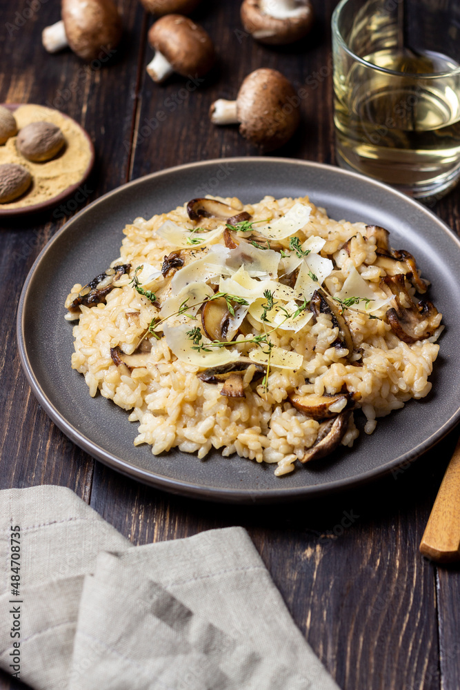 Risotto with mushrooms, cheese and thyme. Vegetarian food. Italian food. Risotto with mushrooms, cheese and thyme. Vegetarian food. Italian food.