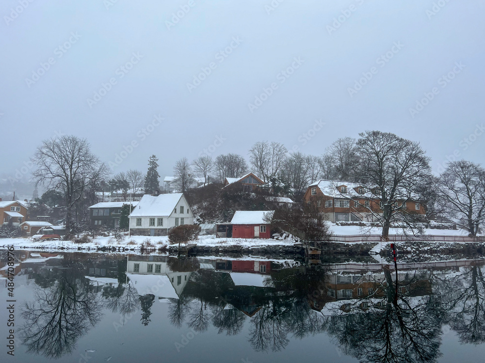 landscape with houses winter ocean or lake in fiordo Norway