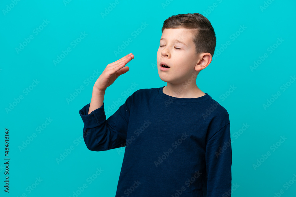 Little kid boy isolated on blue background with tired and sick expression Little kid boy isolated on blue background with tired and sick expression