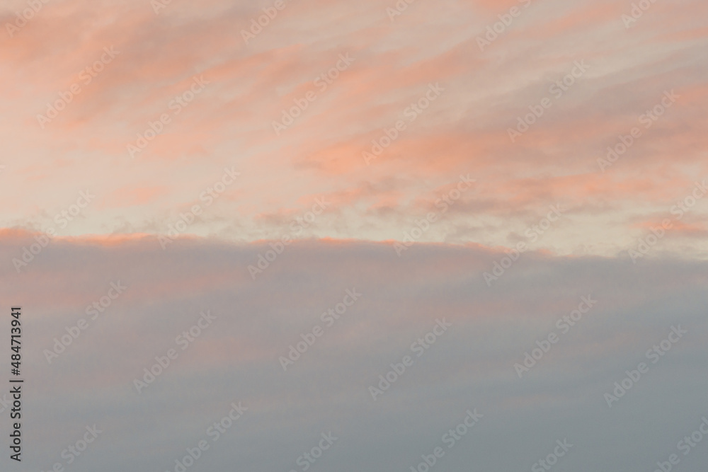 At sunset, blue sky with pink clouds. There is space for text