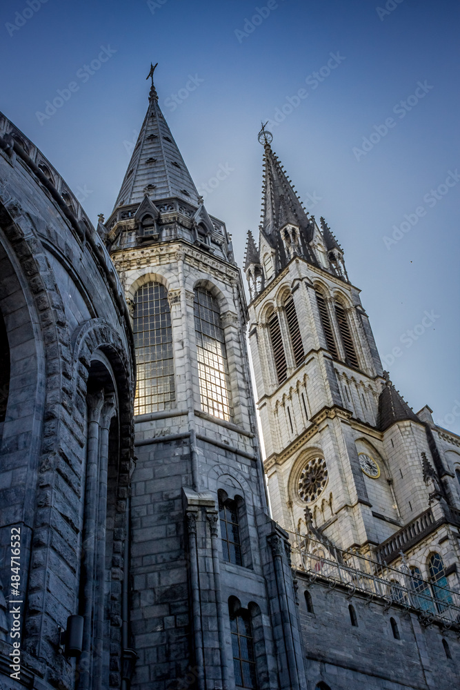 Pilgrimage Center. Sanctuary in Lourdes. Shrine in France. Way of St. James. Notre Dame de Lourdes. Catholic Basilica. Stone church. Saint Bernadette. Nun Bernadette Soubirous.