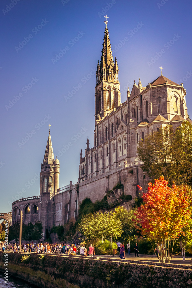 Pilgrimage Center. Sanctuary in Lourdes. Shrine in France. Way of St. James. Notre Dame de Lourdes. Catholic Basilica. Stone church. Saint Bernadette. Nun Bernadette Soubirous.