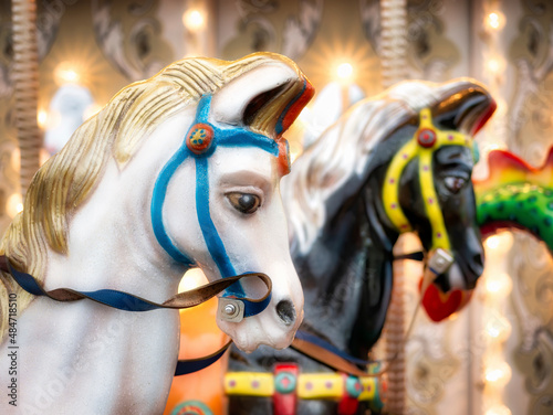 Close up detail with the horses of a carousel amusement ride