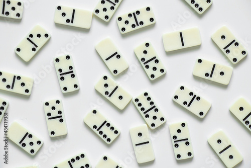 dominoes on a white background close up  domino effect