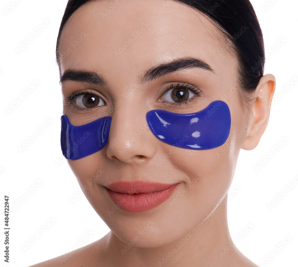 Beautiful young woman with under eye patches on white background Beautiful young woman with under eye patches on white background