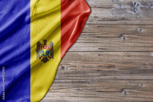 Wooden pattern old nature table board with Moldova flag