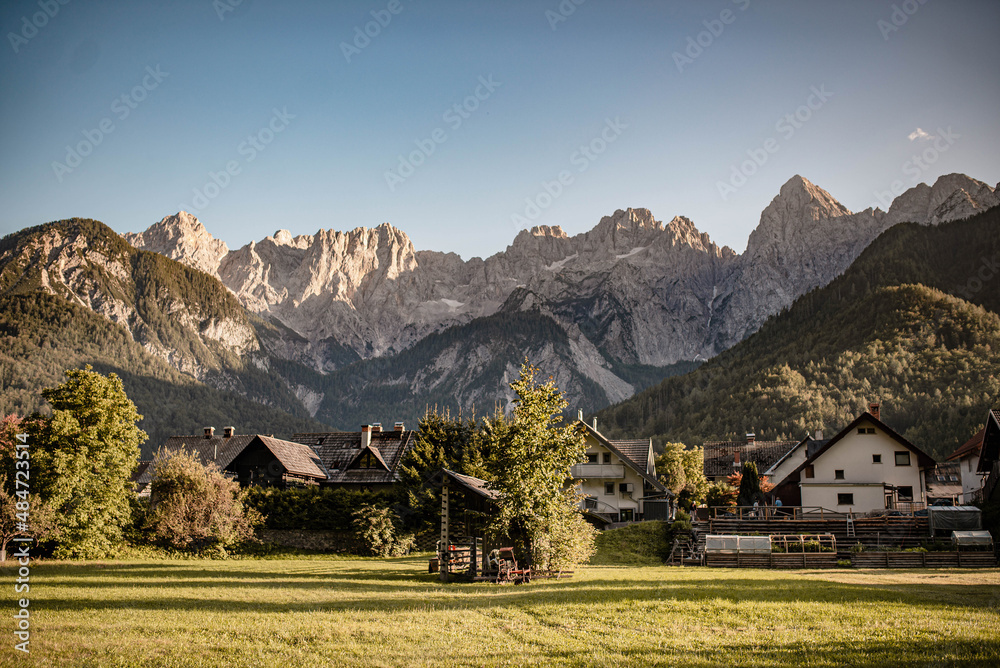 Horizontal photo of meaddow and breathtaking mountain range in Kranjska Gora during late summer evening walk Horizontal photo of meaddow and breathtaking mountain range in Kranjska Gora during late summer evening walk