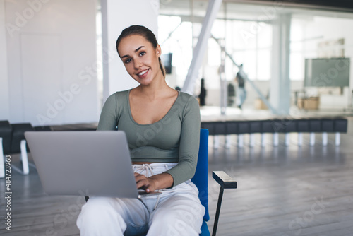 European businesswoman working on laptop in office