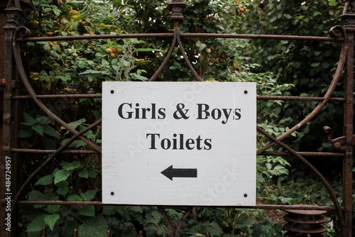 sign for toilets this way girls and boys