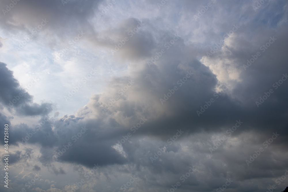 Summer landscape sky before rain. Part of cumulus clouds in the sun. Summer landscape sky before rain. Part of cumulus clouds in the sun.