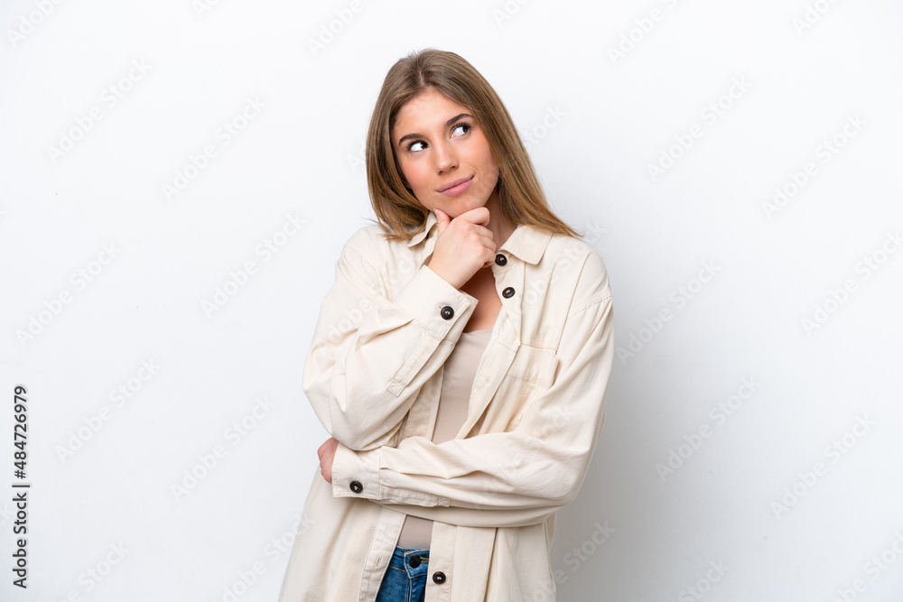 Young caucasian woman isolated on white bakcground thinking an idea while looking up