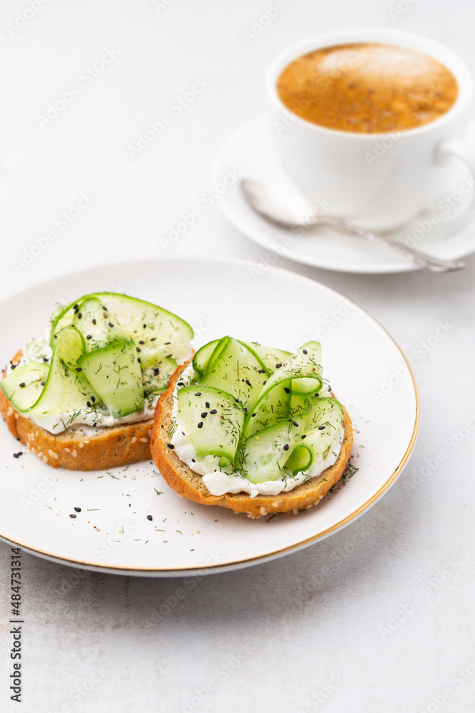 Keto Toasts with ricotta, egg, cucumber and black sesame.