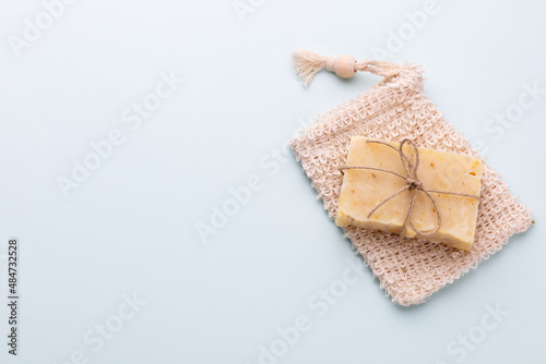 Handmade natural soap on pastel background.