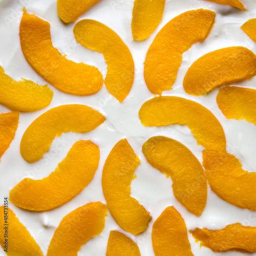 Top view of a delicious appetizing peach dessert. Square format.
