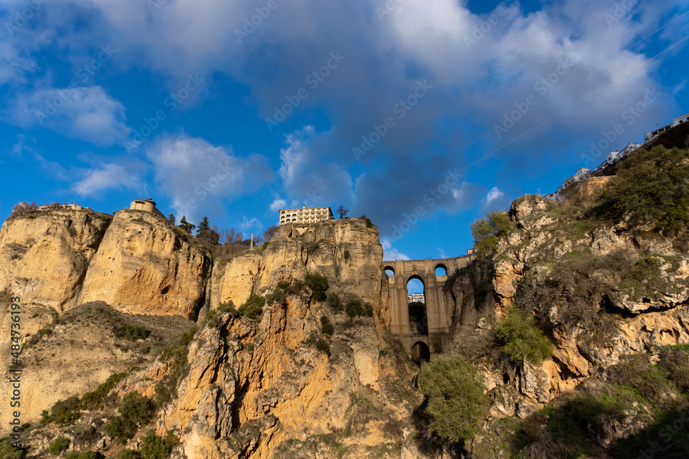 Panoramic view of cliffs and a medieval bridge