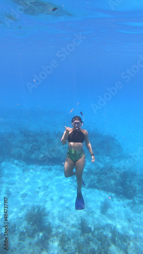 person snorkeling in a lagoon © Camila