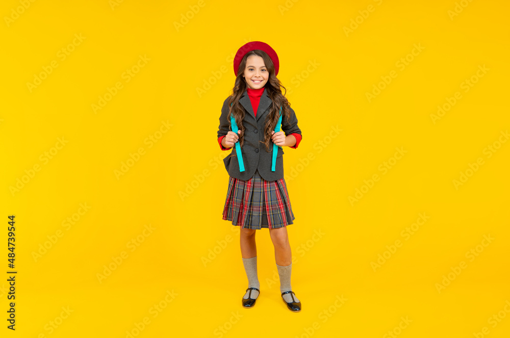 concept of education. kid in uniform on yellow background. september 1. concept of education. kid in uniform on yellow background. september 1.