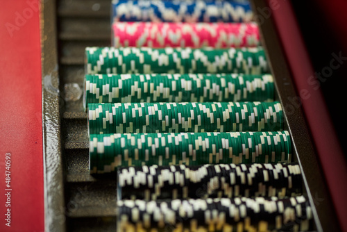 Colourful roulette chips in a casino on a gambling table. Lots of chips with different nomination and colours. multi-colored poker chips. casino chips. online casino, poker, gambling. Gaming table