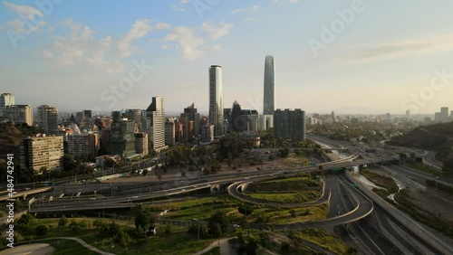 Aerial pan left of Bicentenario Park, golf club and Sanhattan area modern skyscrapers, Santiago, Chile photo