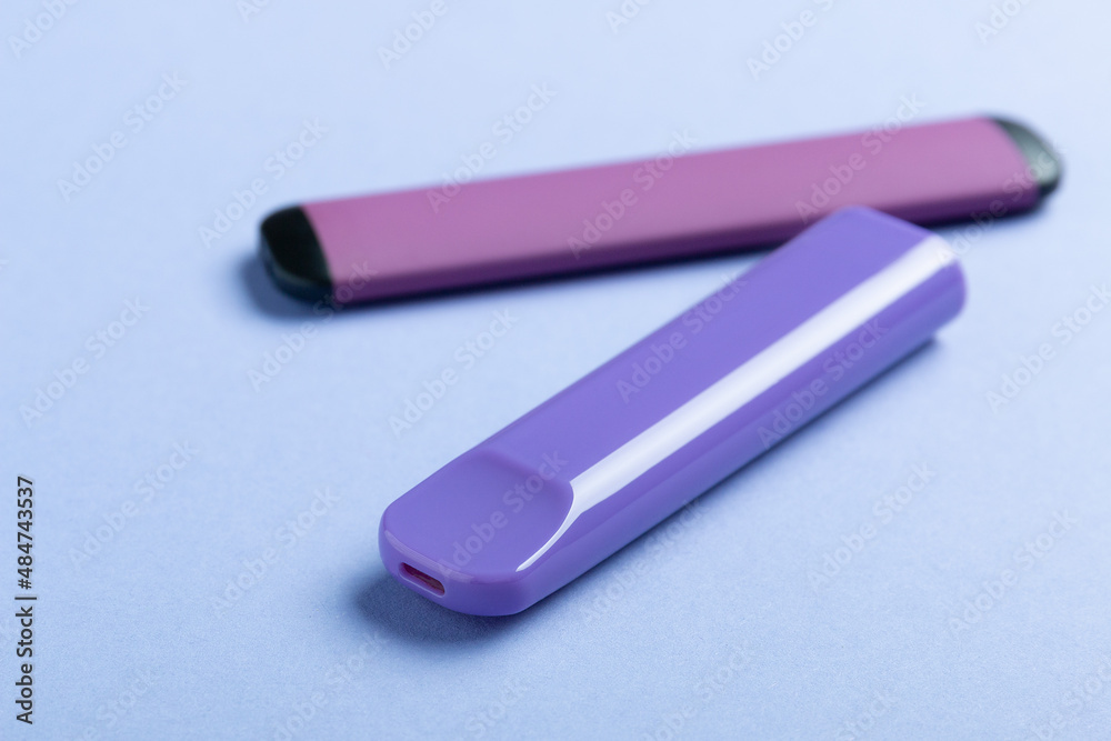 Electronic cigarettes on colored backgrounds Electronic cigarettes on colored backgrounds