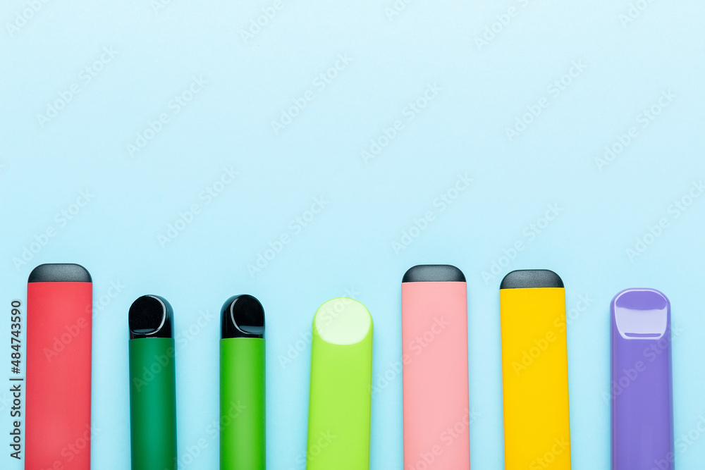 Electronic cigarettes on colored backgrounds Electronic cigarettes on colored backgrounds