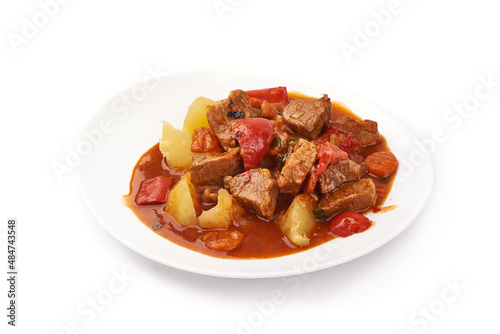 Hungarian goulash, beef, pork stew with potatoes, isolated on white background. photo