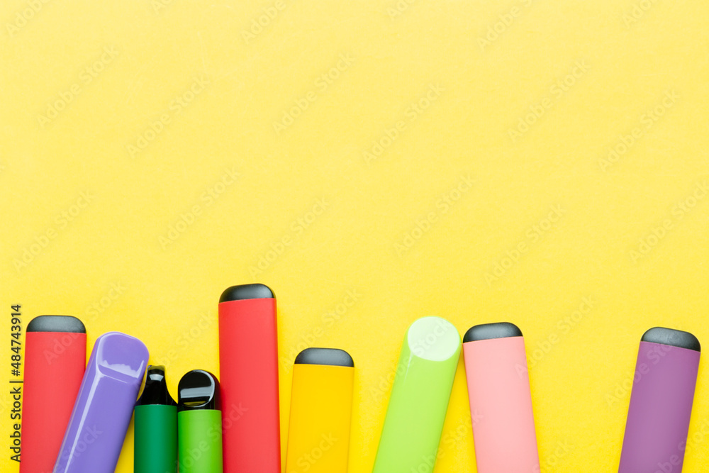 Electronic cigarettes on colored backgrounds Electronic cigarettes on colored backgrounds