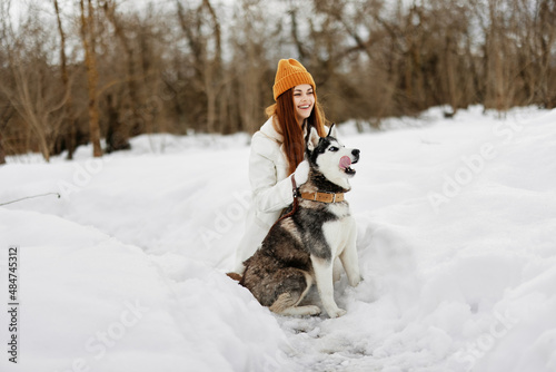 Fototapeta Naklejka Na Ścianę i Meble -  woman with dog winter landscape walk friendship Lifestyle
