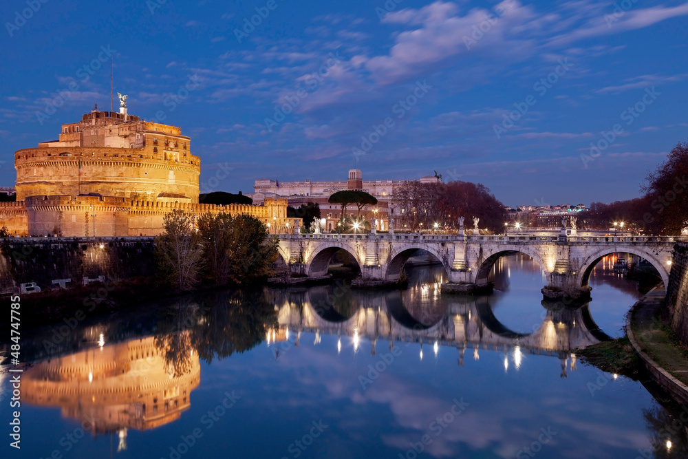 Night falling over Tiber river, Castel Sant'Angelo and Ponte Sant'Angelo of the Vatican City, in Rome, Italy, Europe.