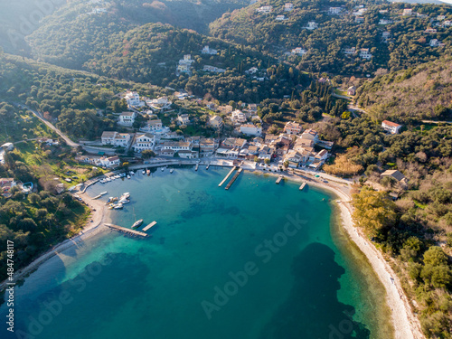 Agios Stefanos bay, one of the most beautiful fishing villages in Corfu Island. Kerkyra, Greece. Aerial drone view.