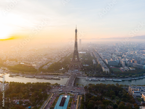 Establishing Aerial view of Paris Cityscape with Eiffel Tower and Seine river on sunrise, France. Landmark Monument as Famous Touristic Destination. Romantic Travel and Urban Skyline Panorama © OPEN FILMS