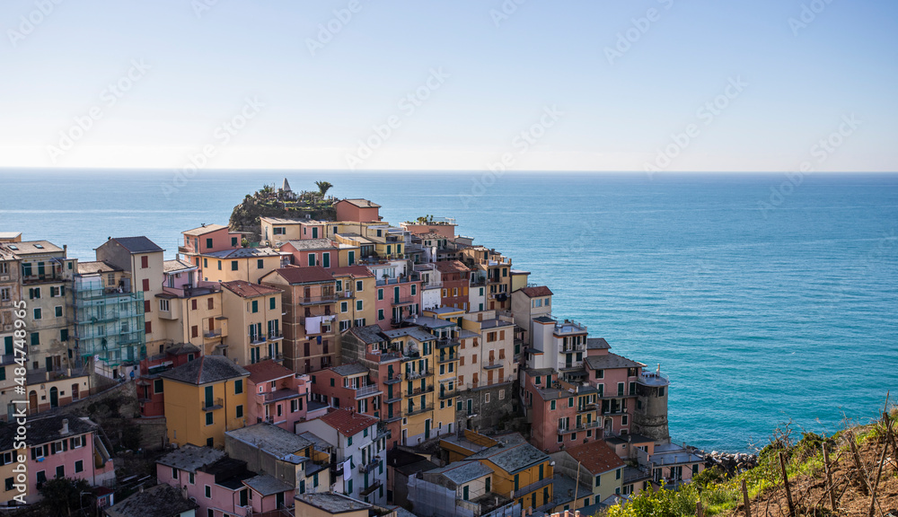 View of Manarola, a beautiful town along the coast of Cinque Terre with colourful buildings, Liguria, Italy.