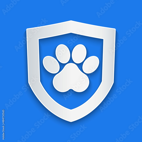 Paper cut Animal health insurance icon isolated on blue background. Pet protection concept. Dog or cat paw print. Paper art style. Vector