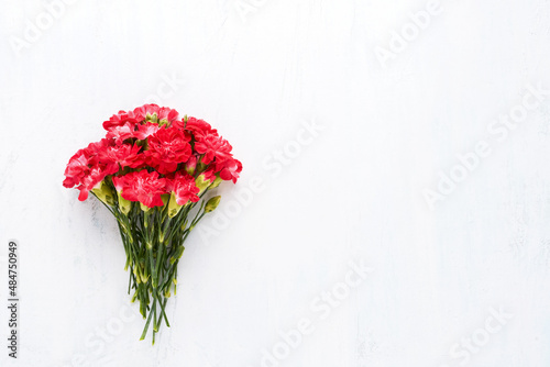 Fototapeta Naklejka Na Ścianę i Meble -  Red carnation flowers bouquet. Mothers Day, Valentines Day, birthday celebration concept