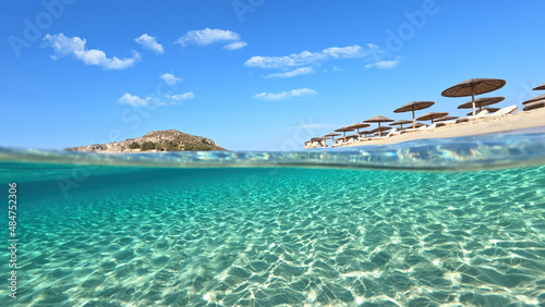 Fototapeta Naklejka Na Ścianę i Meble -  Underwater split photo of paradise exotic island beach with crystal clear turquoise sea in exotic destination island
