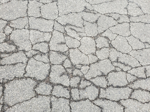 Bild auf Leinwand Texture cracks in the asphalt of the road