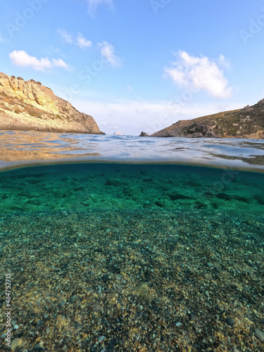 Underwater split photo of paradise beach of Melidoni in island of Kythira, Ionian sea, Greece