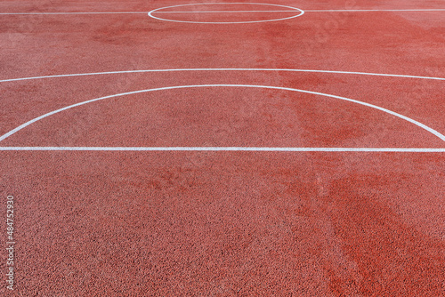 Garnet basketball half-court. Front view. Copy space.