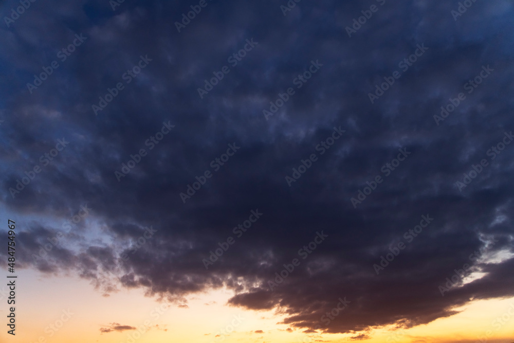 Dramatic bright clouds after sunset sky. 
Sky background.